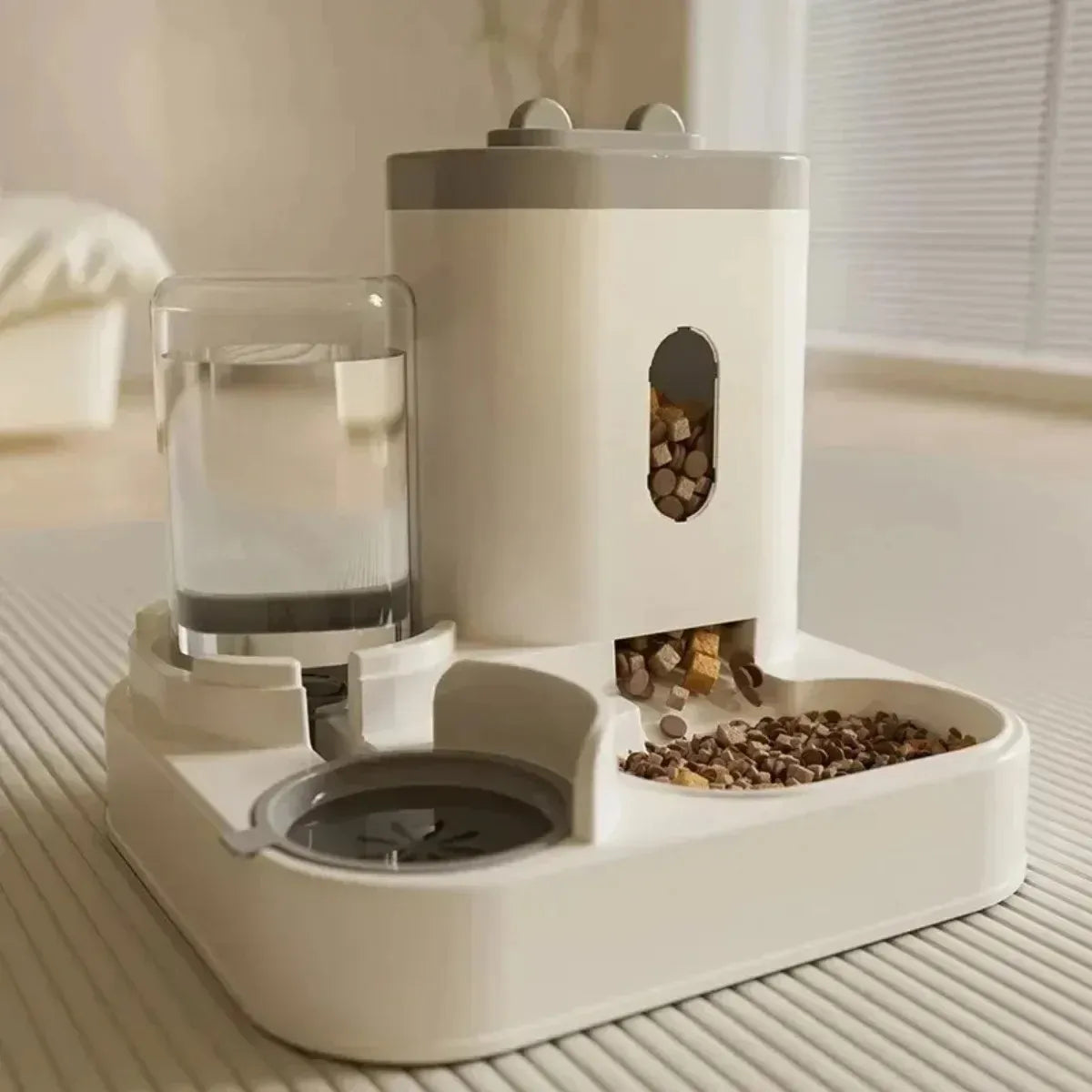 Pet feeding and water station with a glass of water and food on a light surface.